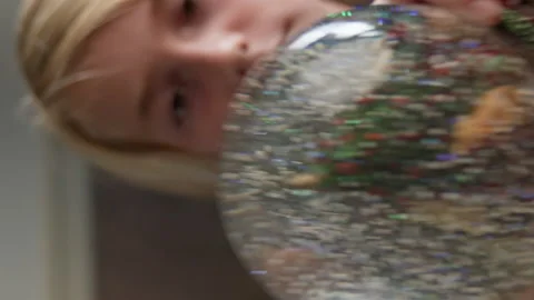 Boy playing with snow globe Stock Footage 219461758
