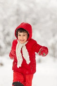 Boy playing in the snow Stock Photos