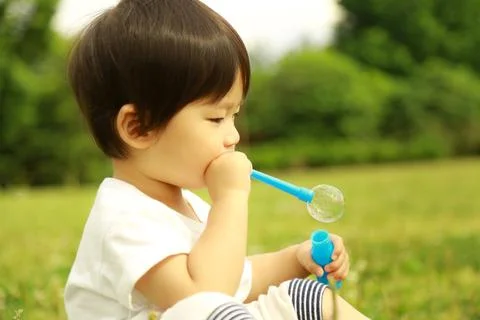 Boy playing with soap Stock Photos