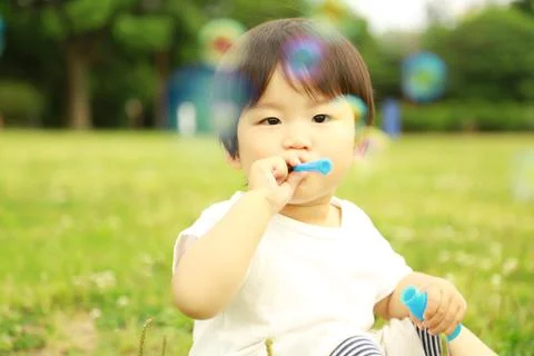 Boy playing with soap Stock Photos