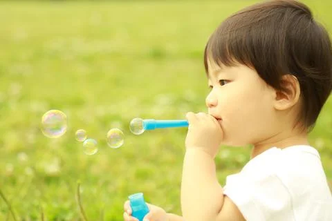 Boy playing with soap Stock Photos