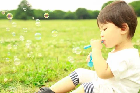 Boy playing with soap Stock Photos