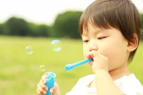 Boy playing with soap Stock Photos