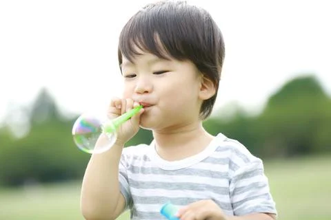 Boy playing with soap Stock Photos