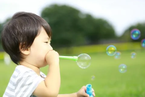 Boy playing with soap Stock Photos
