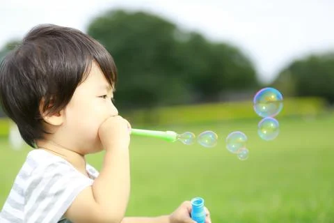 Boy playing with soap Stock Photos