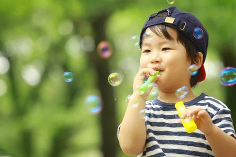Boy playing with soap Stock Photos