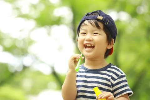 Boy playing with soap Stock Photos