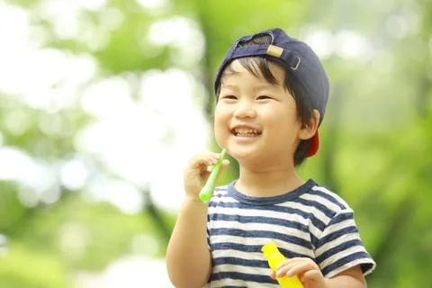 Boy playing with soap Stock Photos