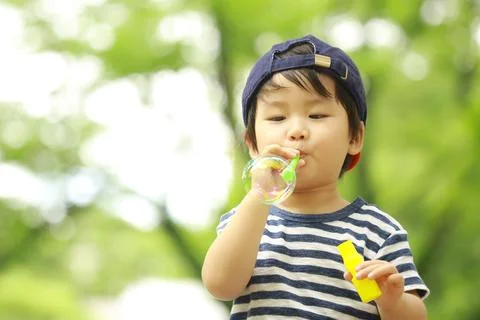 Boy playing with soap Stock Photos