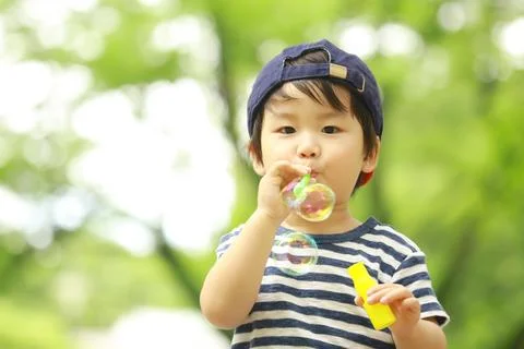 Boy playing with soap Stock Photos