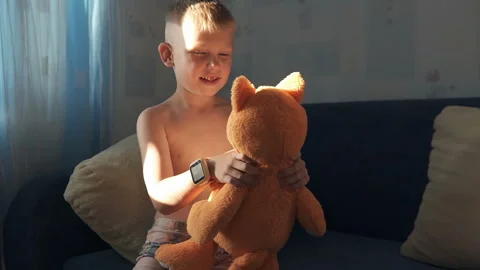 A boy is playing with a soft toy Stock Footage 115254867