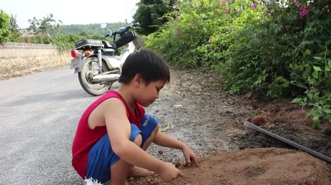 Boy playing in soil dust Stock Footage 45919448