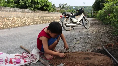 Boy playing in soil dust Stock-Footage 45919464