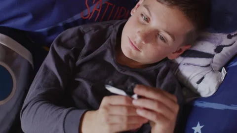 Boy playing with the space shuttle toy in his bedroom Stock Footage 264286016