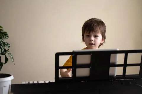 A boy playing the synthesizer Stock Photos