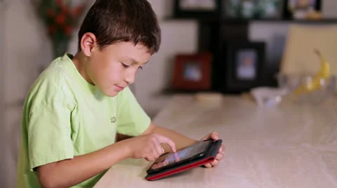 Boy playing with a tablet Stock Footage 23115771