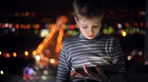 Boy playing on a tablet Stock Footage 61730343