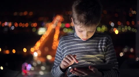 Boy playing on a tablet Stock Footage 61730382