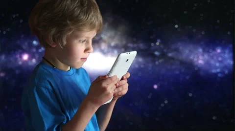 Boy playing with tablet pc. Close up of boy and tablet device in hands playing Stock Footage 46904704
