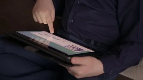 Boy playing on a tablet.Full hd video Stock Footage 72119572