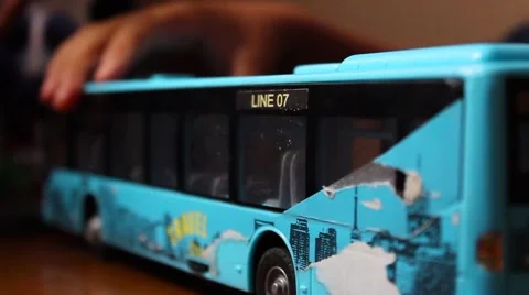 Boy playing toy bus Stock-Footage 65300484