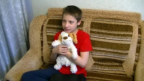 Boy playing with toy dog Stock Footage 75078311