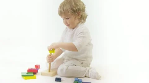 Boy playing with toy Видео 11011519