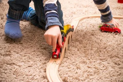 Boy playing with train Photos