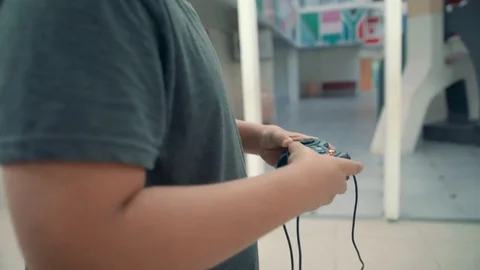 Boy playing with video game controller Stock Footage 81203607