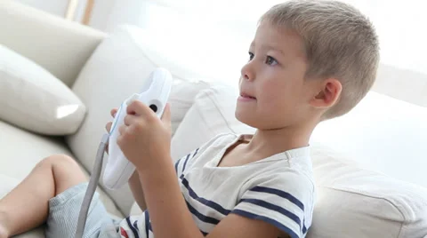 Boy playing video game Video stock 30838946