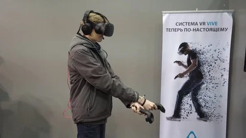 Boy playing video game with HTC Vive VR glasses Stock Footage 72288868
