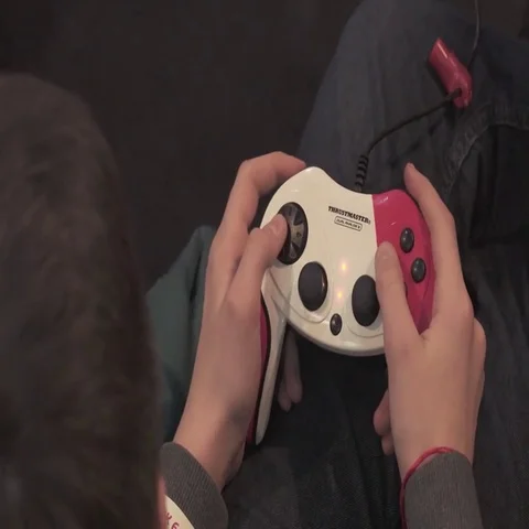 Boy playing video game with joystick. Playing games console. Close Up Stock Footage 69648951