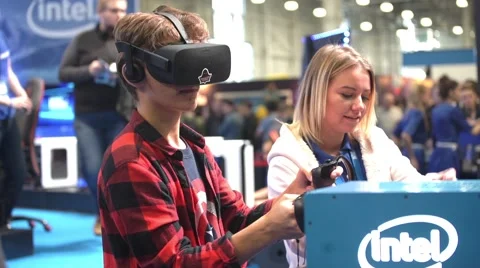 Boy playing video game with Oculus Development Kit VR glasses Stock Footage 68449530