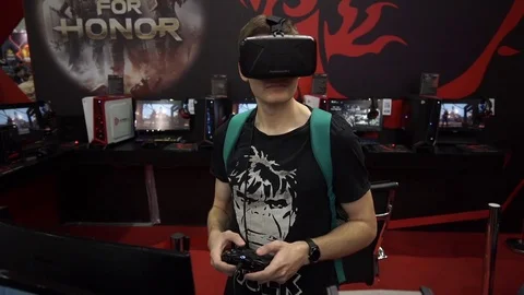Boy playing video game with Oculus Development Kit VR glasses 스톡 동영상 69739600