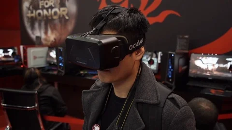 Boy playing video game with Oculus Development Kit VR glasses. 스톡 동영상 77269073