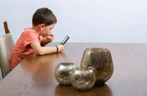 Boy playing video game Stock Photos