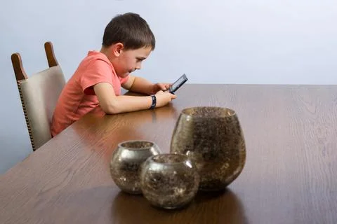 Boy playing video game Stock Photos