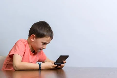 Boy playing video game Stock Photos
