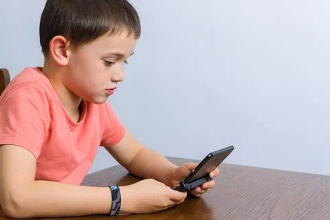 Boy playing video game Stock Photos