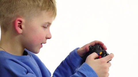 Boy playing video game in slow motion. White background, closeup Vidéo 75927840