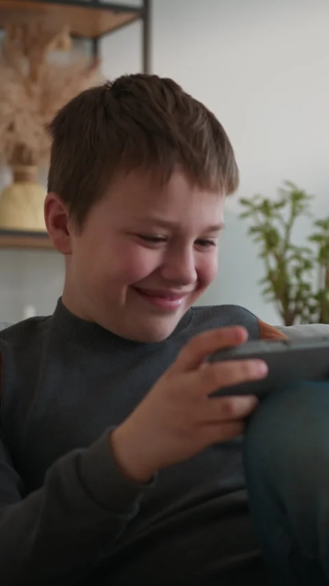 Boy Playing Video Game on Tablet Stock Footage 335476203