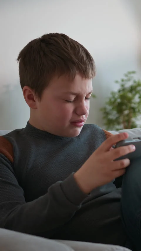 Boy Playing Video Game on Tablet Stock Footage 335486560
