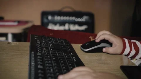 A boy playing video games on the sofa with mouse and keyboard. Dollty shot Stock Footage 68143267