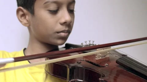 Boy playing violin Stock Footage 49684579