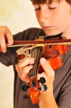 Boy Playing the Violin Stock Photos