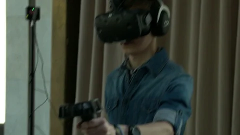 Boy Playing A Virtual Reality Game At A Comic-Con Stock Footage 90134741