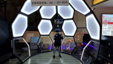 A boy playing Virtual Reality (VR) game in Shanghai Stock Footage 165633136