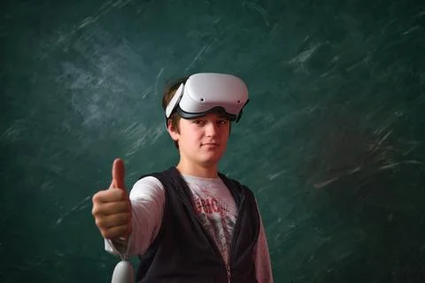A boy playing with VR glasses 스톡 사진