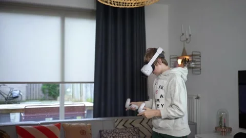 Boy playing with VR goggles climbing Stock Footage 146289008